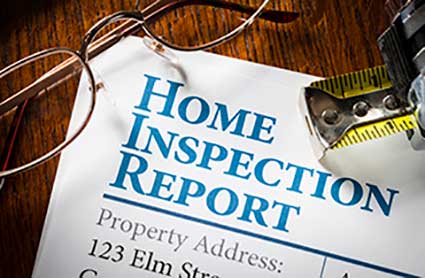 home-inspection-report-with-tape-measurea-and-glasses-on-a-wooden-table-top3